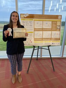 Ashley Tarcin with one of her posters at AAFP.