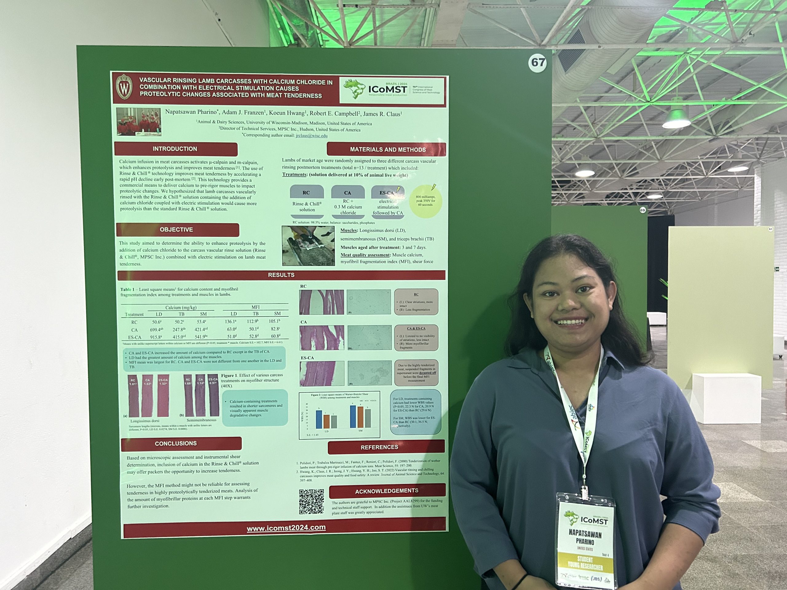 Pat Pharino in front of poster at ICoMST.